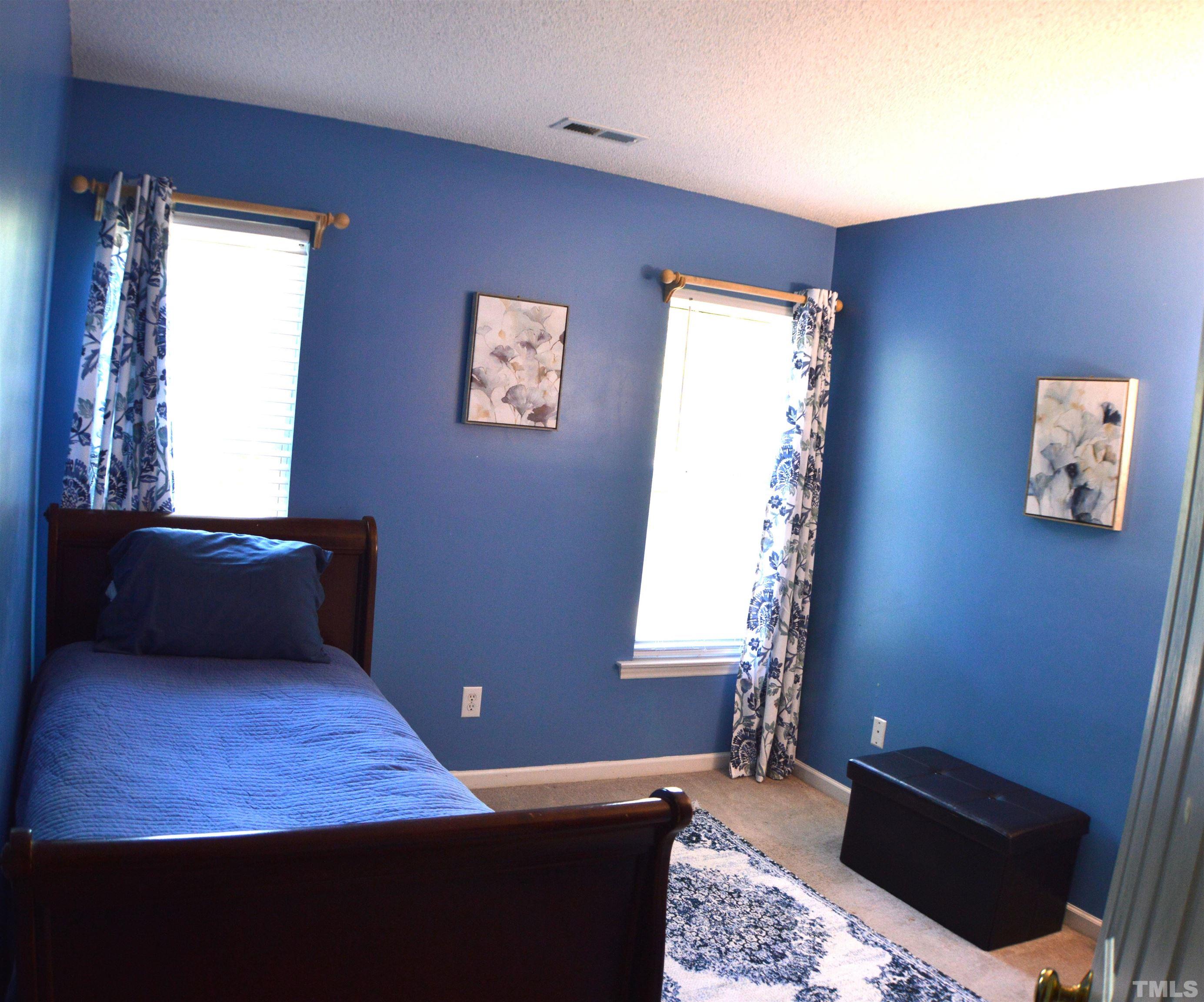 6523 Caverstone Lane Durham, NC 27713 - Photo 15 of 29 a room with furniture and window