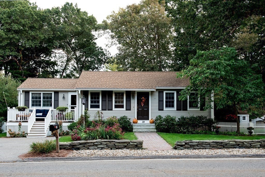39 George Brown Street Billerica, MA 01821 - Photo 1 of 29 a front view of a house with a yard and outdoor seating