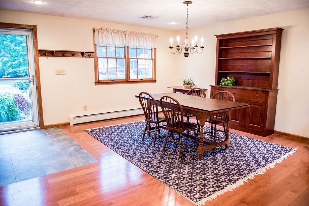 39 George Brown Street Billerica, MA 01821 - Photo 11 of 29 a view of a dining room with furniture and wooden floor