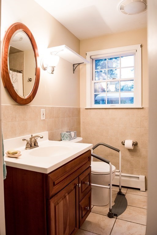 39 George Brown Street Billerica, MA 01821 - Photo 17 of 29 a bathroom with a sink and a mirror