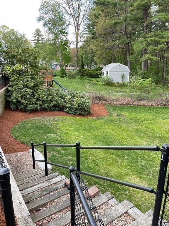 39 George Brown Street Billerica, MA 01821 - Photo 20 of 29 a view of a deck with a table and chairs