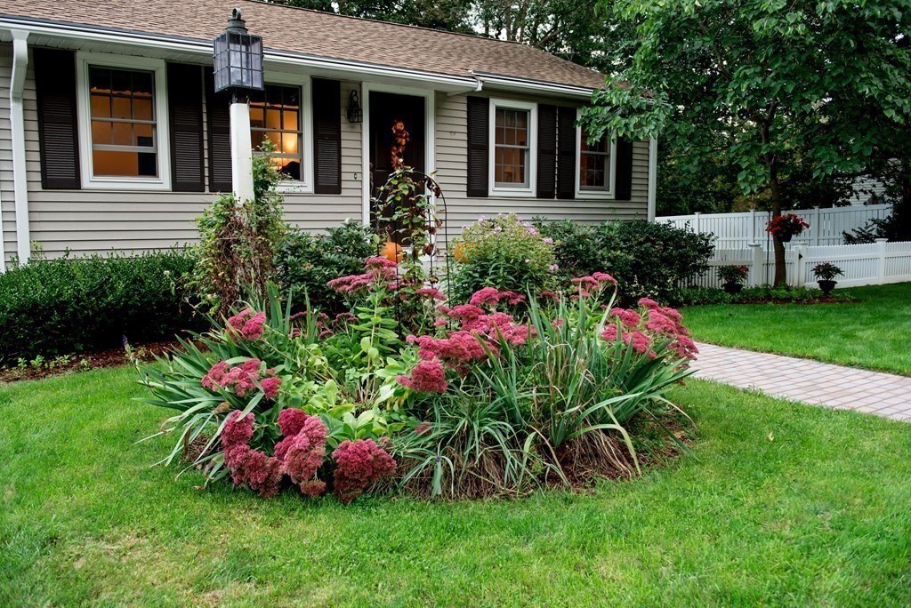 39 George Brown Street Billerica, MA 01821 - Photo 3 of 29 a view of a potted sitting and chair sitting in front of a house