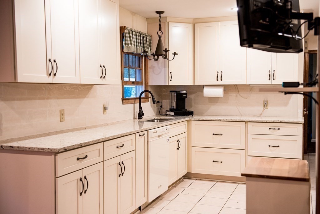39 George Brown Street Billerica, MA 01821 - Photo 6 of 29 a kitchen with cabinets appliances and a sink