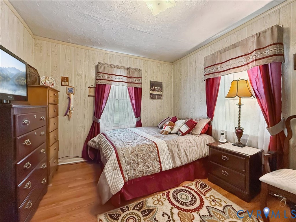 6266 Richmond Road Williamsburg, VA 23188 - Photo 11 of 27 a bedroom with a bed and a window