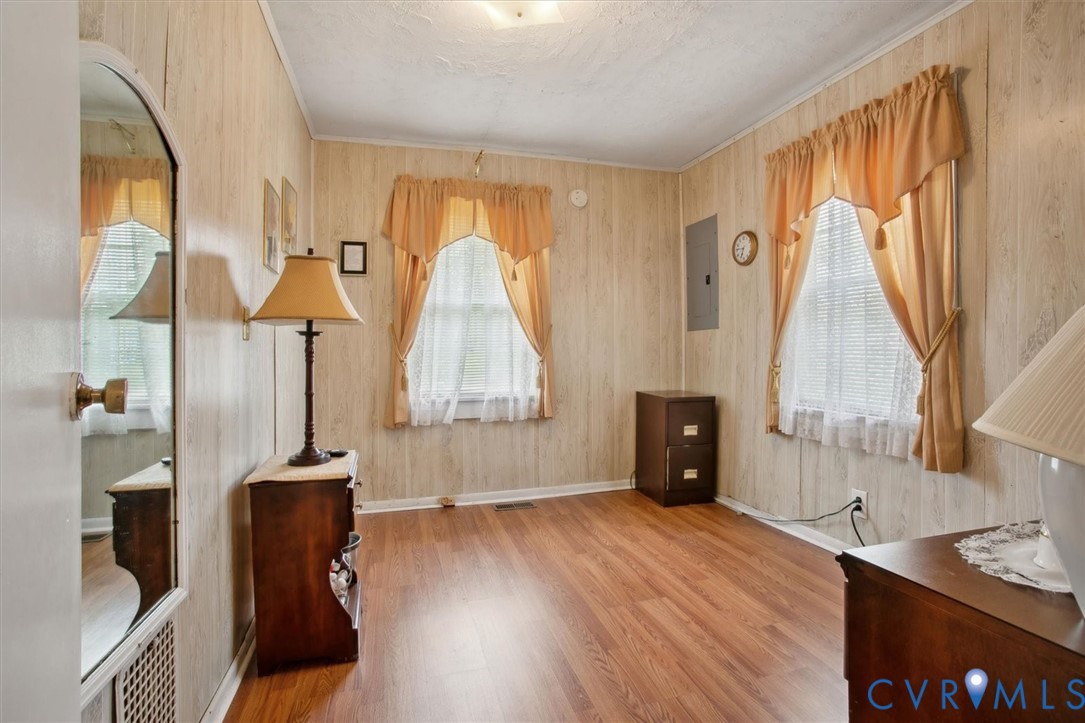 6266 Richmond Road Williamsburg, VA 23188 - Photo 12 of 27 a view of a room with wooden floor and furniture