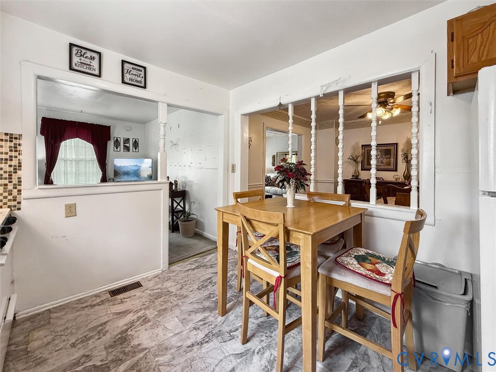 6266 Richmond Road Williamsburg, VA 23188 - Photo 16 of 27 a view of a dining room with furniture window and outside view