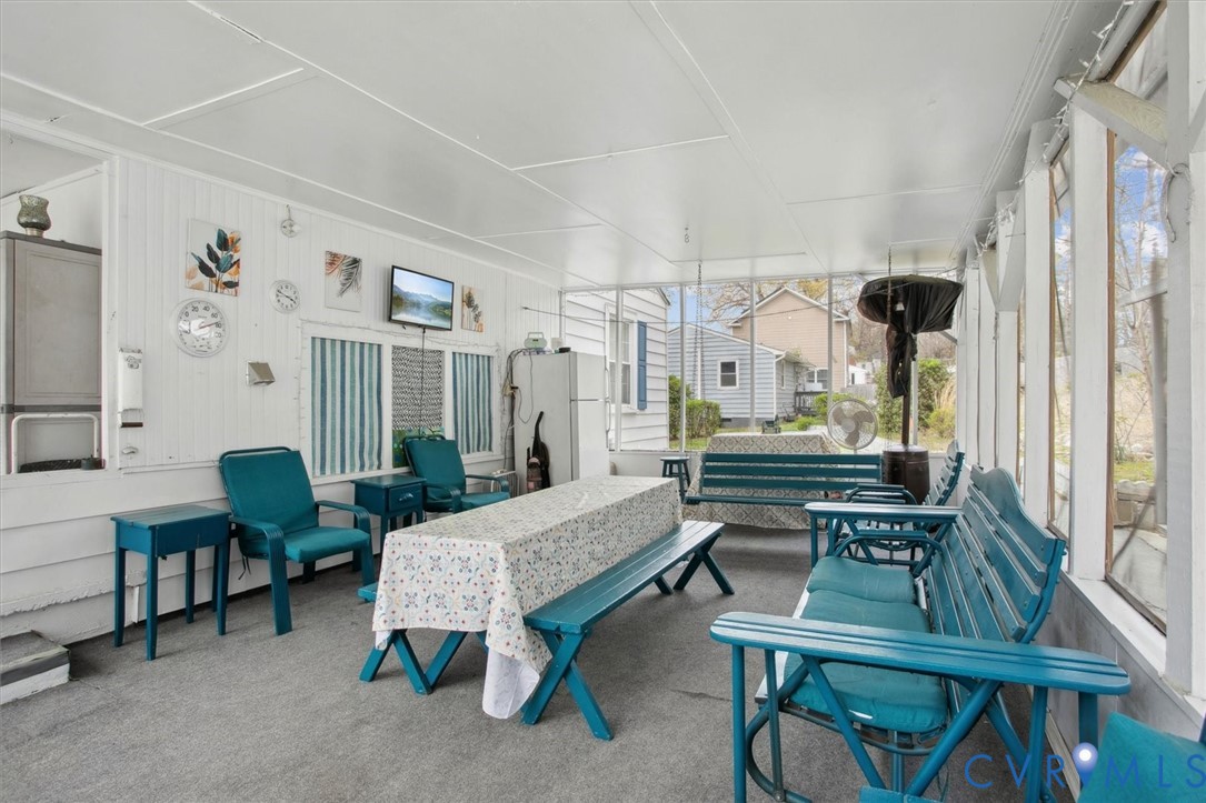 6266 Richmond Road Williamsburg, VA 23188 - Photo 20 of 27 a bedroom with furniture and a large window