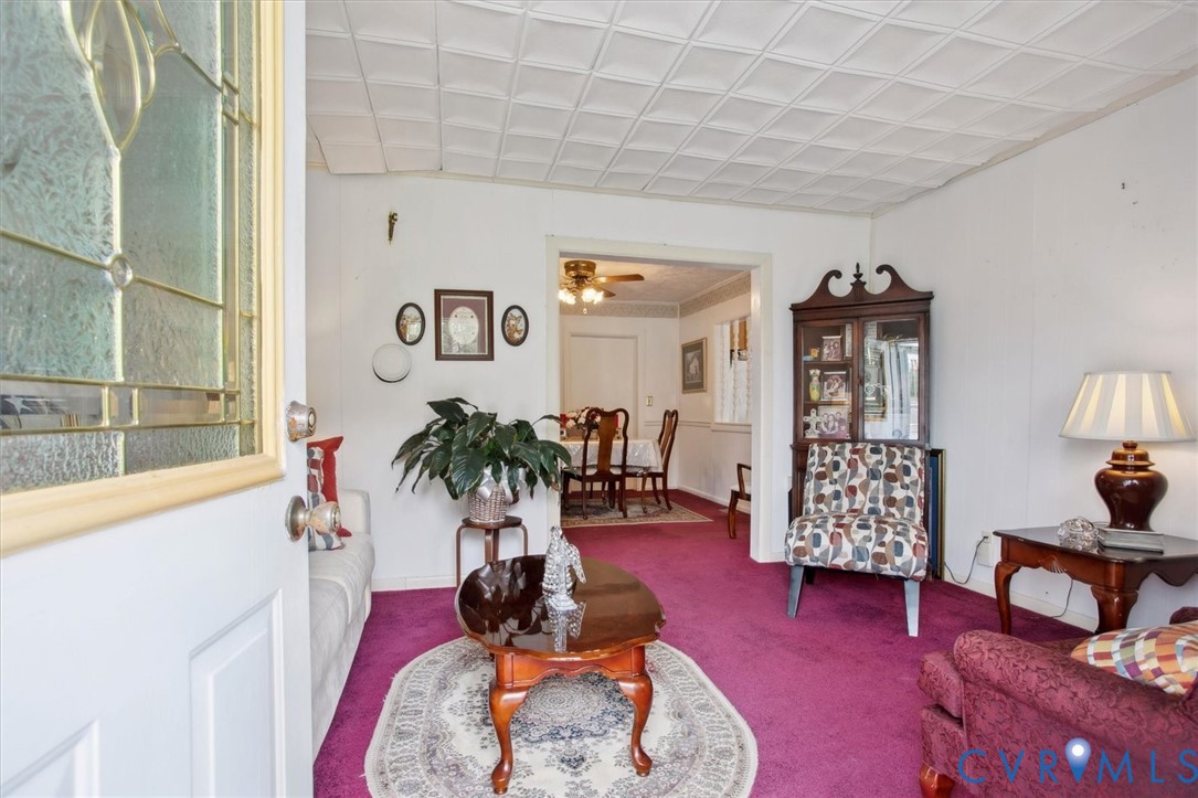 6266 Richmond Road Williamsburg, VA 23188 - Photo 2 of 27 a living room with furniture and wooden floor