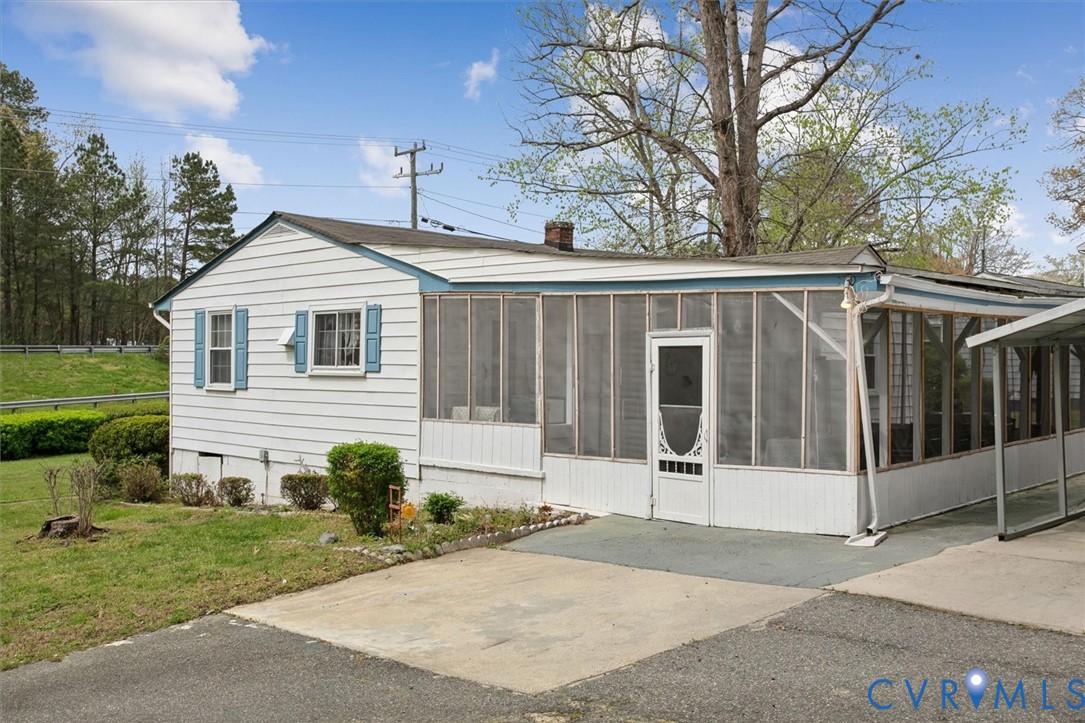 6266 Richmond Road Williamsburg, VA 23188 - Photo 22 of 27 a view of a house with a garden