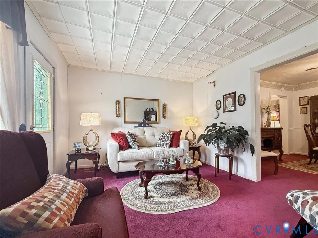 6266 Richmond Road Williamsburg, VA 23188 - Photo 5 of 27 a living room with furniture and a table