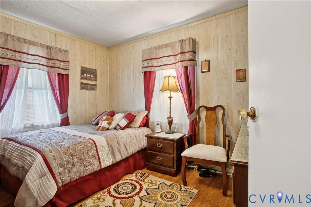 6266 Richmond Road Williamsburg, VA 23188 - Photo 10 of 27 a bedroom with a bed and a window