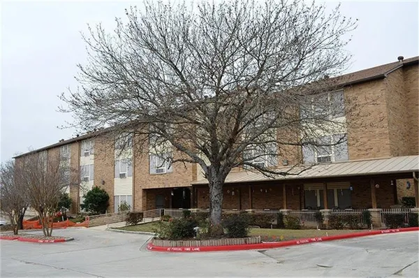 a front view of building with street