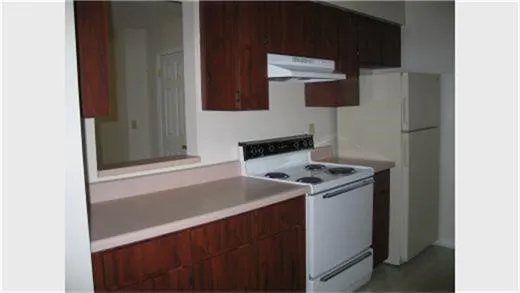 a kitchen with a stove and a microwave