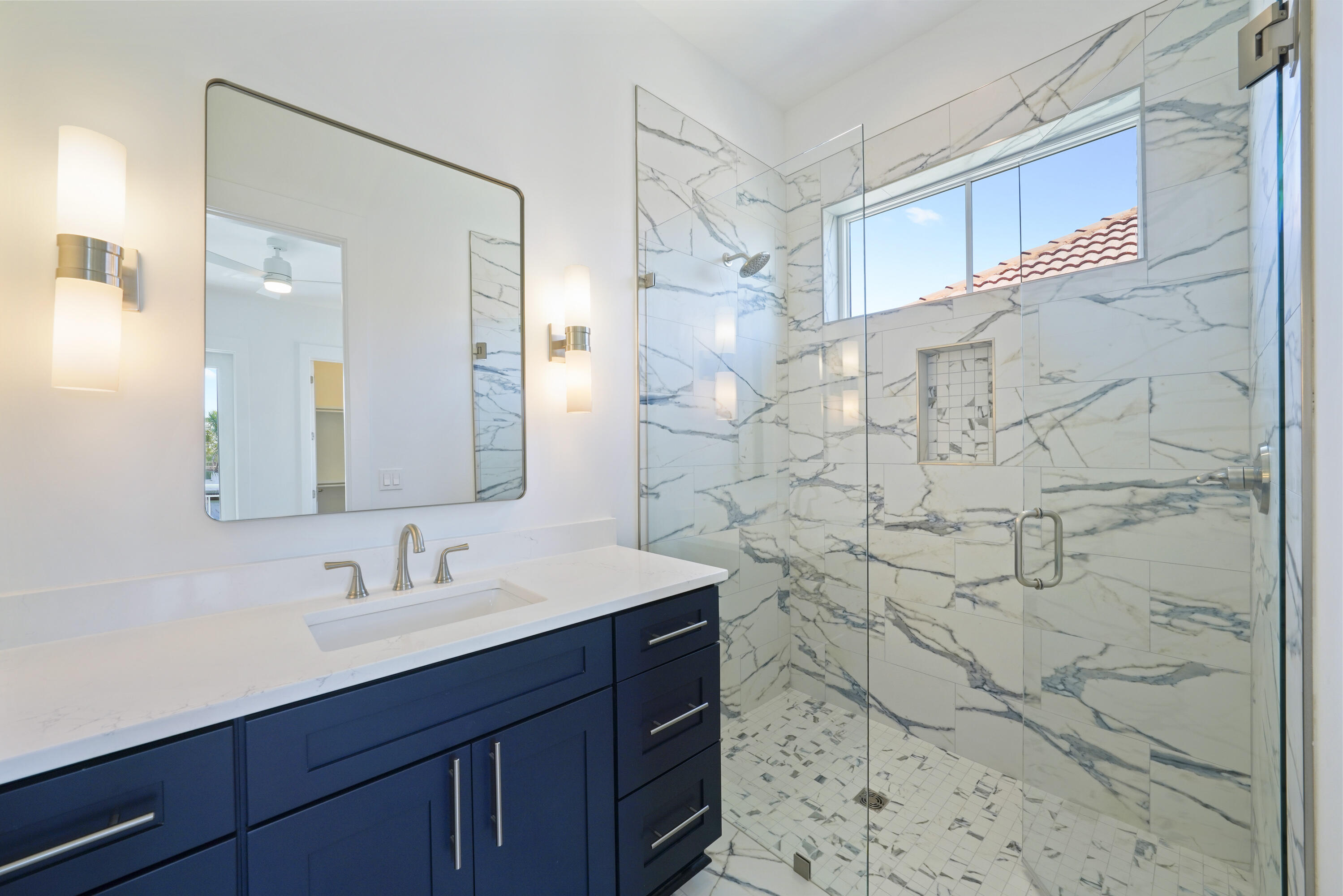 4734 Amhurst Circle Destin, FL 32541 - Photo 23 of 28 Image #23 | Bathroom with marble tile sh