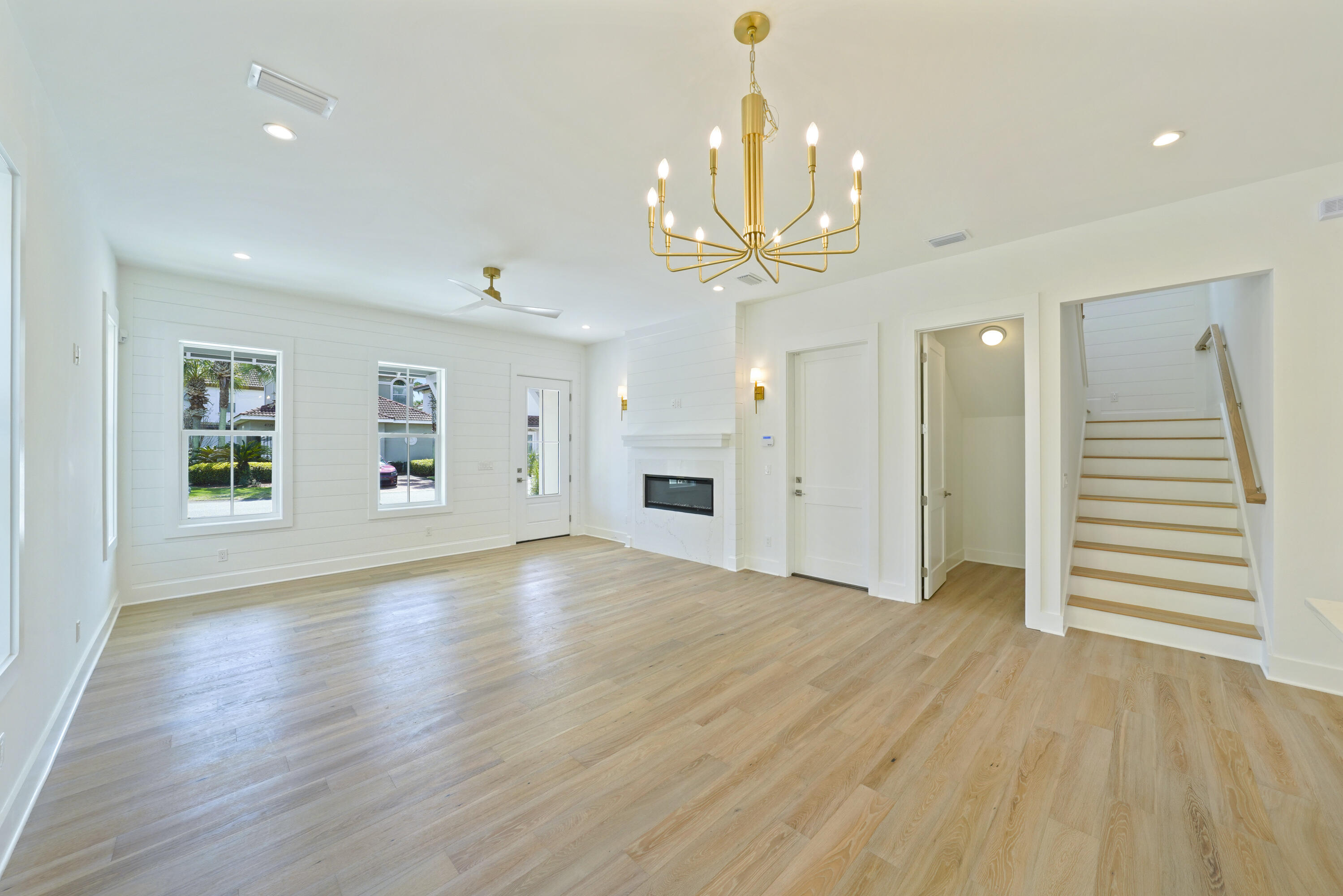 4734 Amhurst Circle Destin, FL 32541 - Photo 5 of 28 Image #5 | Living room angle with stairc