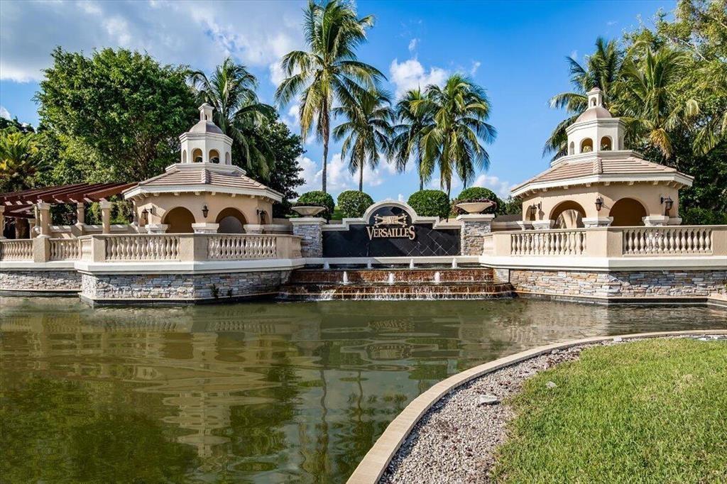 10295 Trianon Place Wellington, FL 33449 - Photo 3 of 26 a view of a lake with house