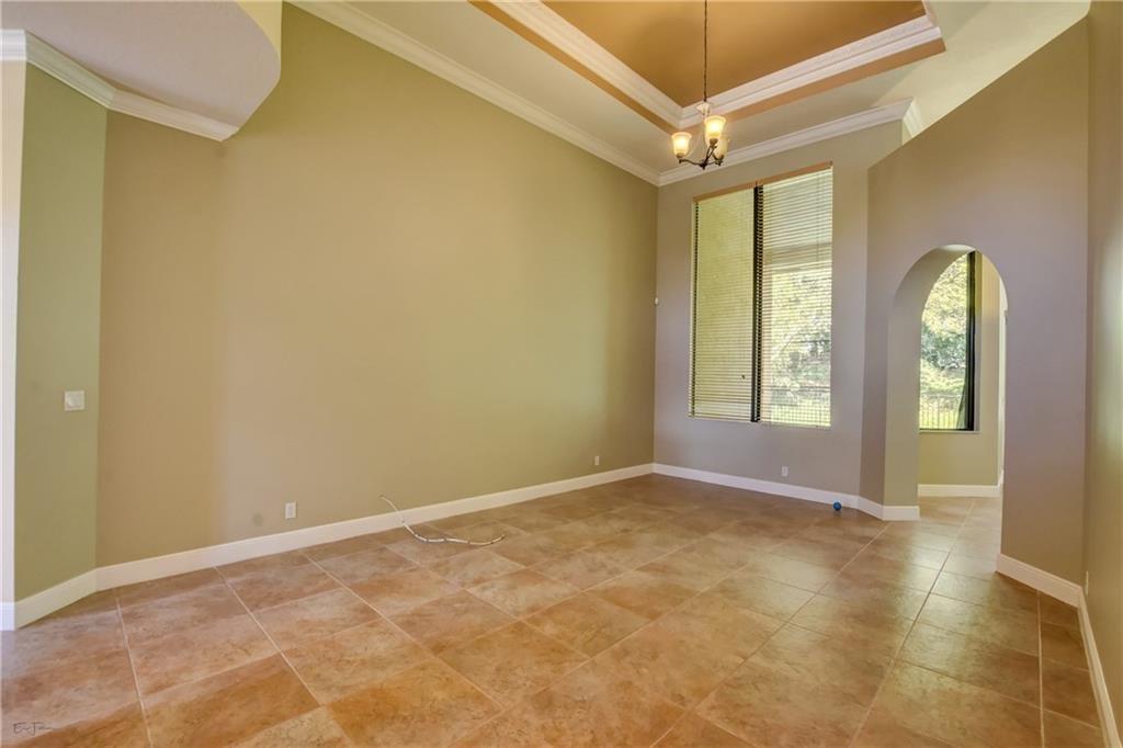10295 Trianon Place Wellington, FL 33449 - Photo 5 of 26 an empty room with windows and closet