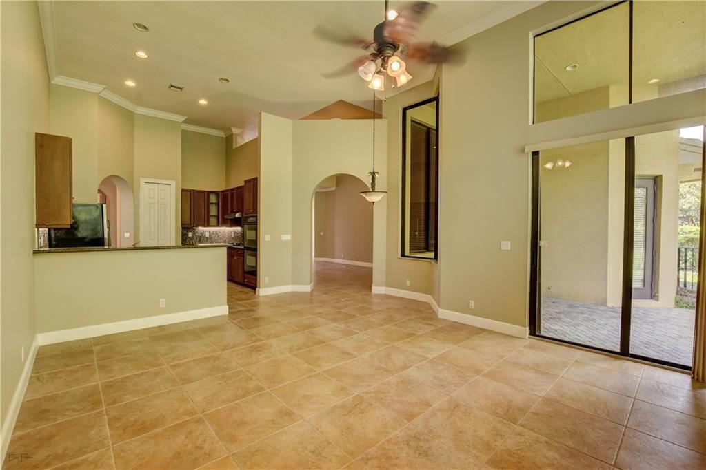 10295 Trianon Place Wellington, FL 33449 - Photo 7 of 26 a view of a kitchen with a sink and a refrigerator