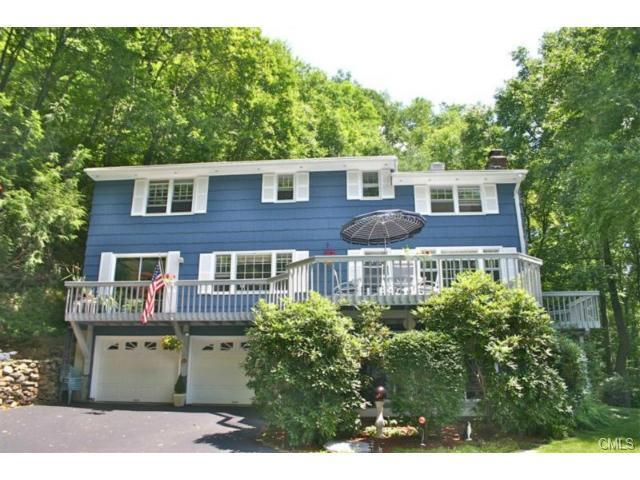 39 Clayton Place Ridgefield, CT 06877 - Photo 1 of 1 a aerial view of a house with a yard and potted plants