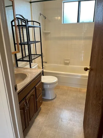 a bathroom with a sink a toilet and a bathtub