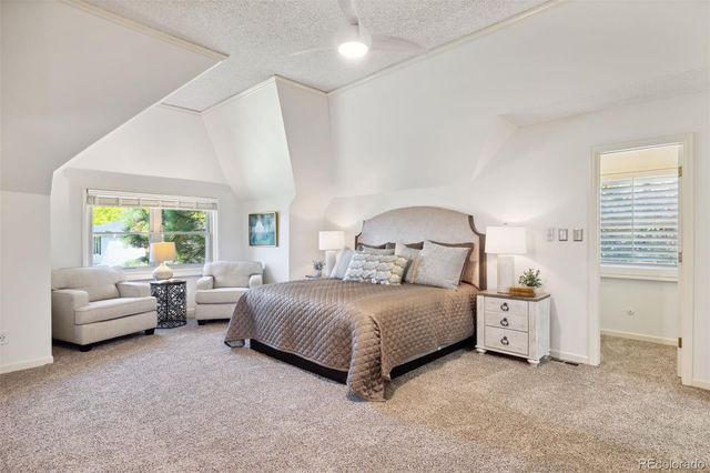 a bedroom with a bed and a couch