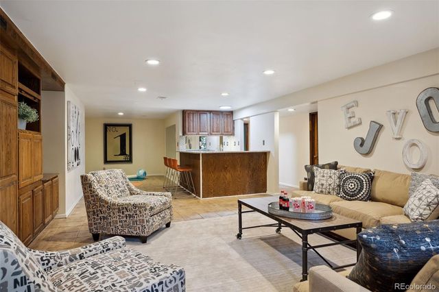 a living room with furniture and a rug