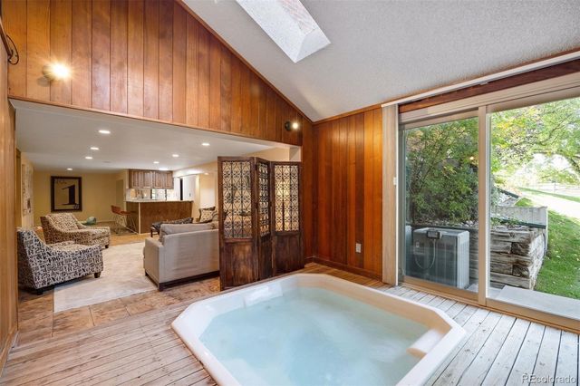 a living room with furniture and large windows