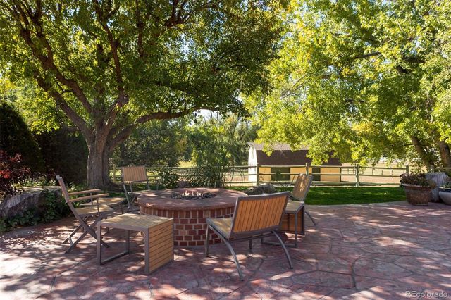 a view of a backyard with sitting area