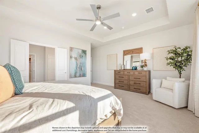 a bedroom with a large bed and a couch