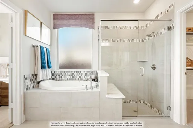 a bathroom with a bathtub sink and mirror