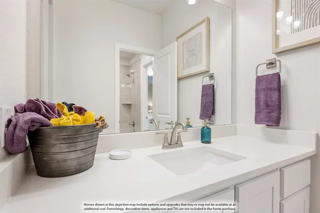 a bathroom with a tub sink and mirror