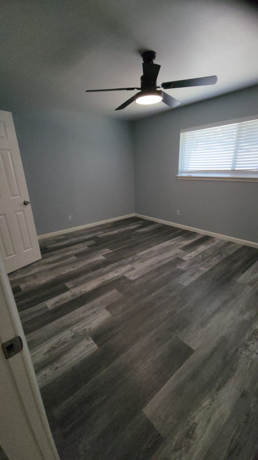 2677 Gessner Road, Unit 202 Houston, TX 77080 - Photo 3 of 7 a view of empty room with window and ceiling fan