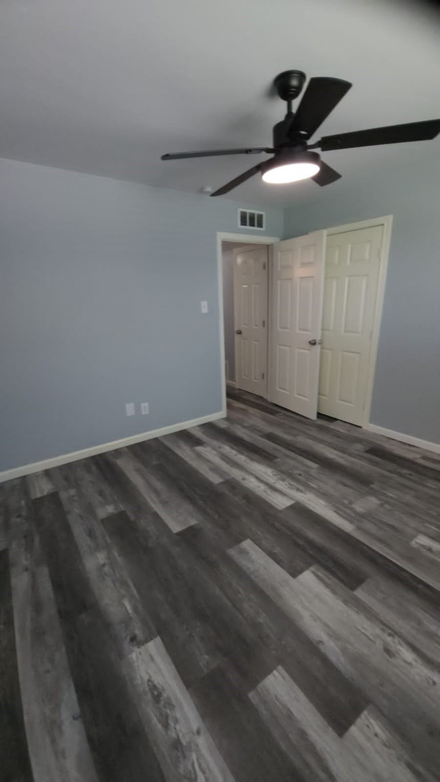 2677 Gessner Road, Unit 202 Houston, TX 77080 - Photo 4 of 7 a view of empty room with wooden floor
