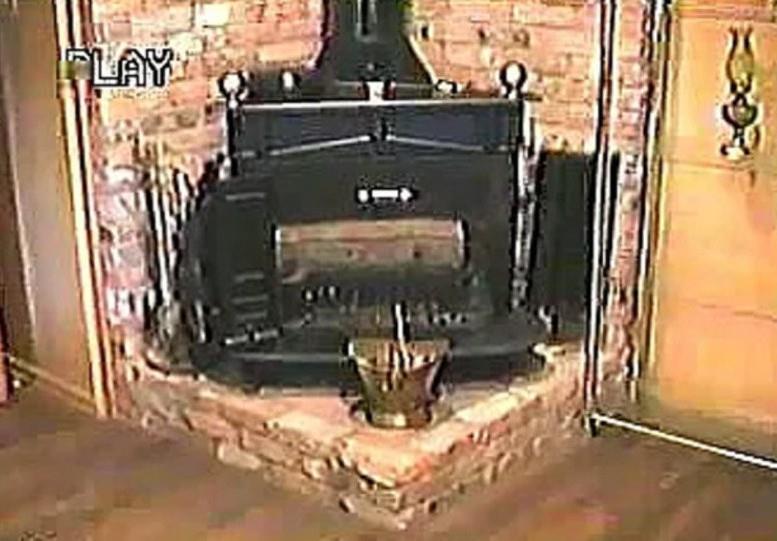 5208 Caladium Drive Dallas, TX 75229 - Photo 7 of 9 a view of a living room with a fireplace