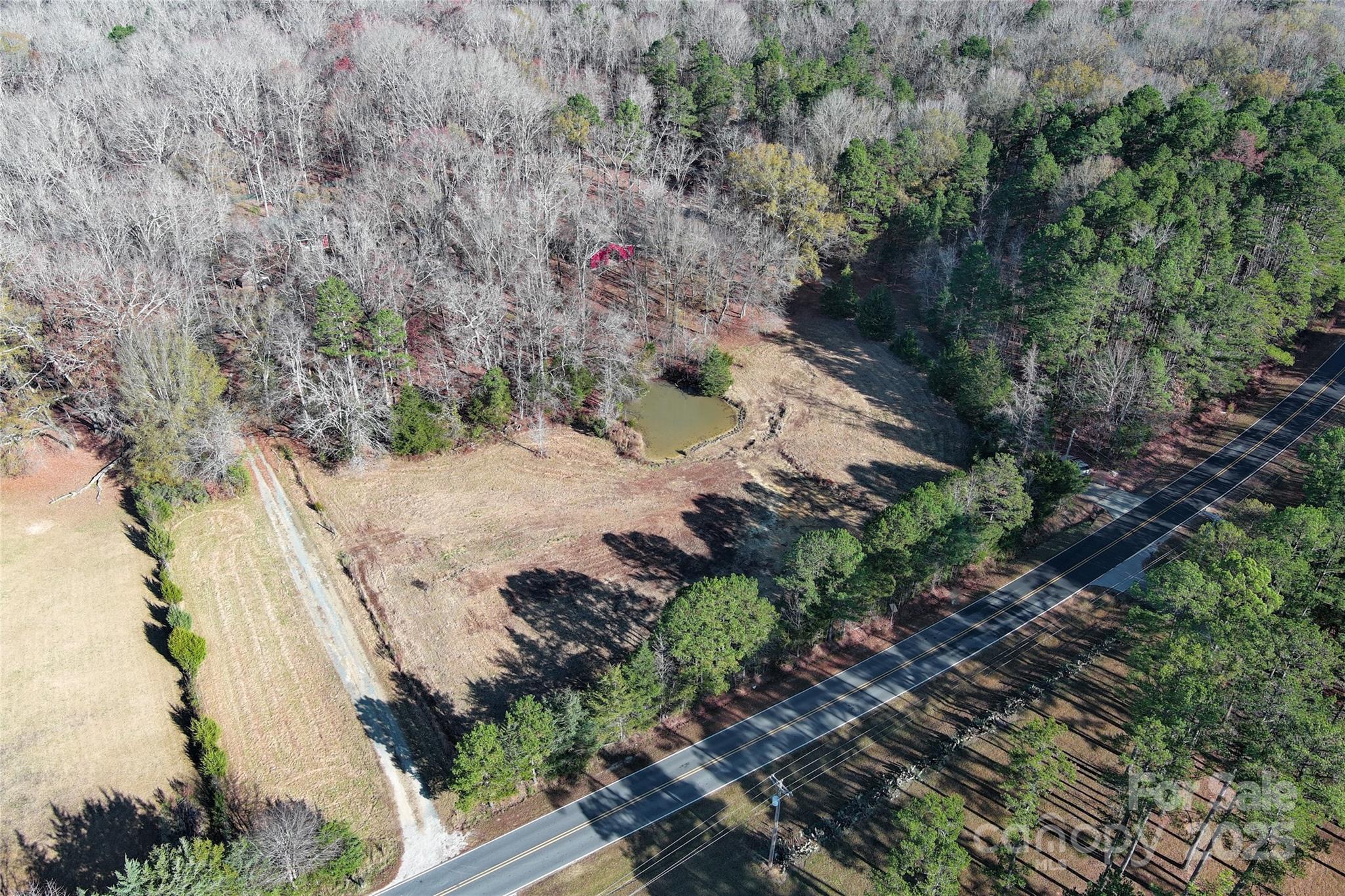 7204 Nesbit Road Waxhaw, NC 28173 - Photo 1 of 25 a view of a pathway with a yard
