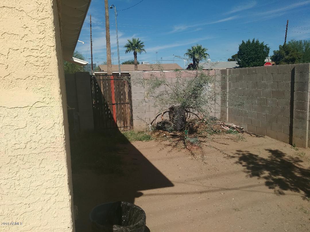 5401 West Osborn Road Phoenix, AZ 85031 - Photo 16 of 18 osborn side yard leading to front yard.