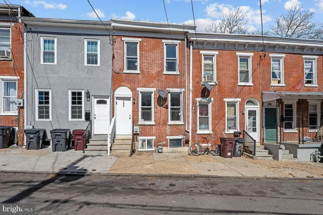 a front view of a building with street view