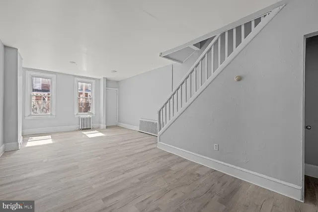 a view of an entryway with wooden floor