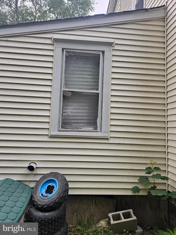 a front view of a house with parking space