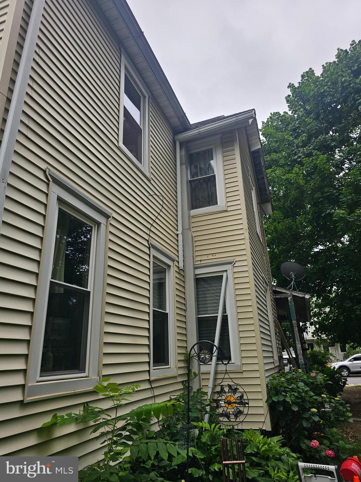 604 Spruce Street Delanco, NJ 08075 - Photo 5 of 9 a view of a house with a yard and potted plants