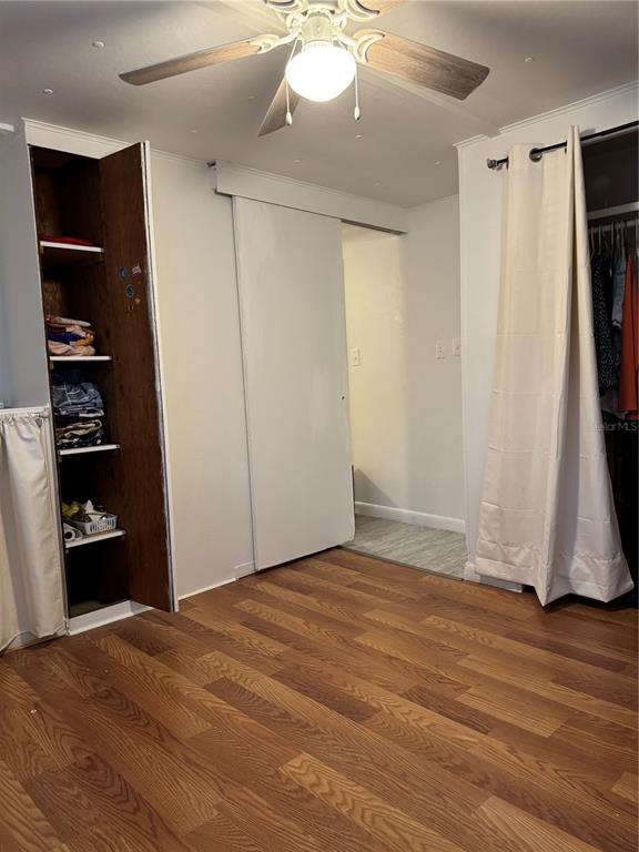 7289 Toucan Trail Spring Hill, FL 34606 - Photo 17 of 27 a view of an empty room with closet and wooden floor