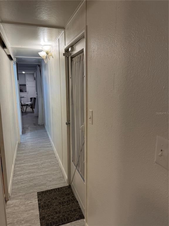 7289 Toucan Trail Spring Hill, FL 34606 - Photo 18 of 27 a view of a hallway with wooden floor and staircase