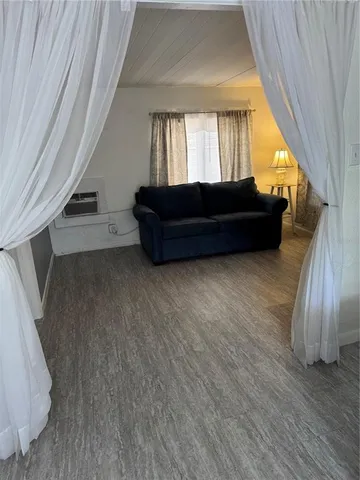 a view of a livingroom with furniture and staircase