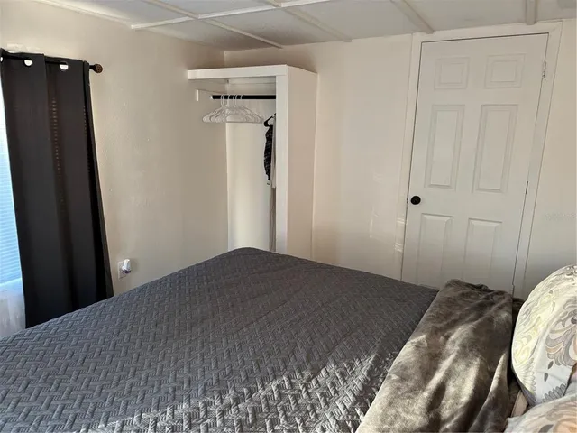 a living room with a couch and a window