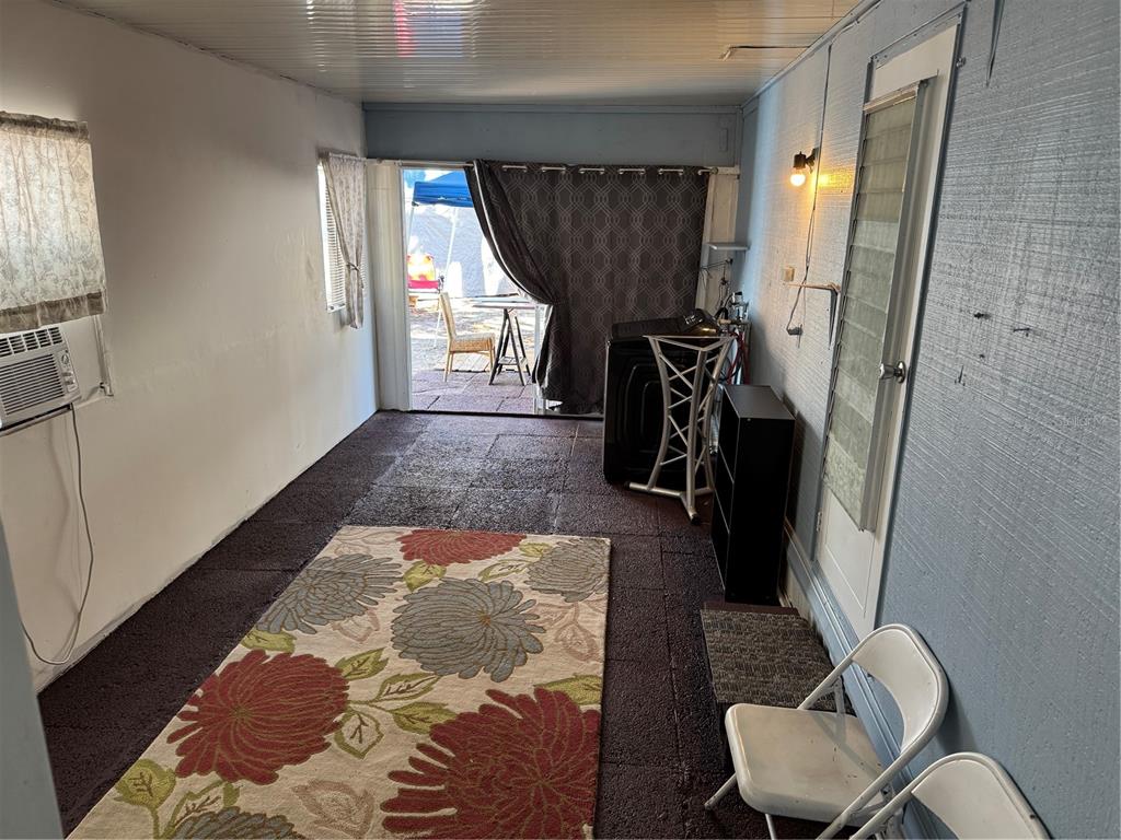 7289 Toucan Trail Spring Hill, FL 34606 - Photo 24 of 27 a living room with furniture and a window