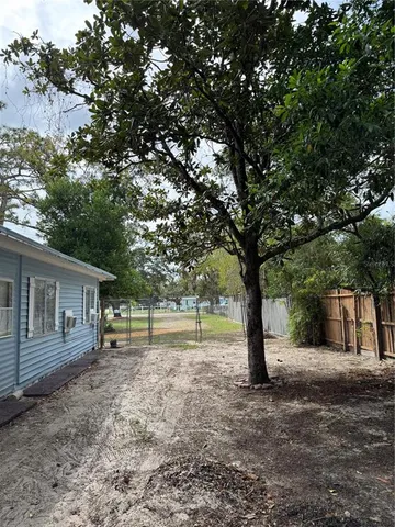 a view of outdoor space with deck and tree