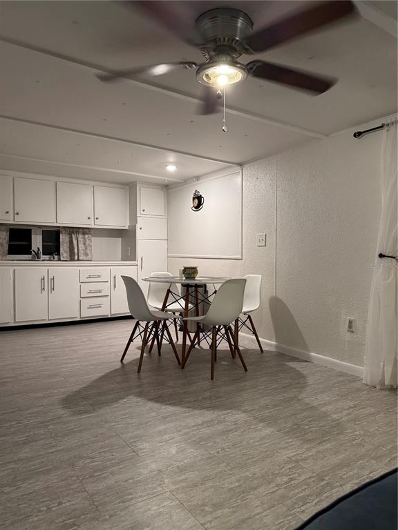 7289 Toucan Trail Spring Hill, FL 34606 - Photo 8 of 27 a view of a kitchen and dining room