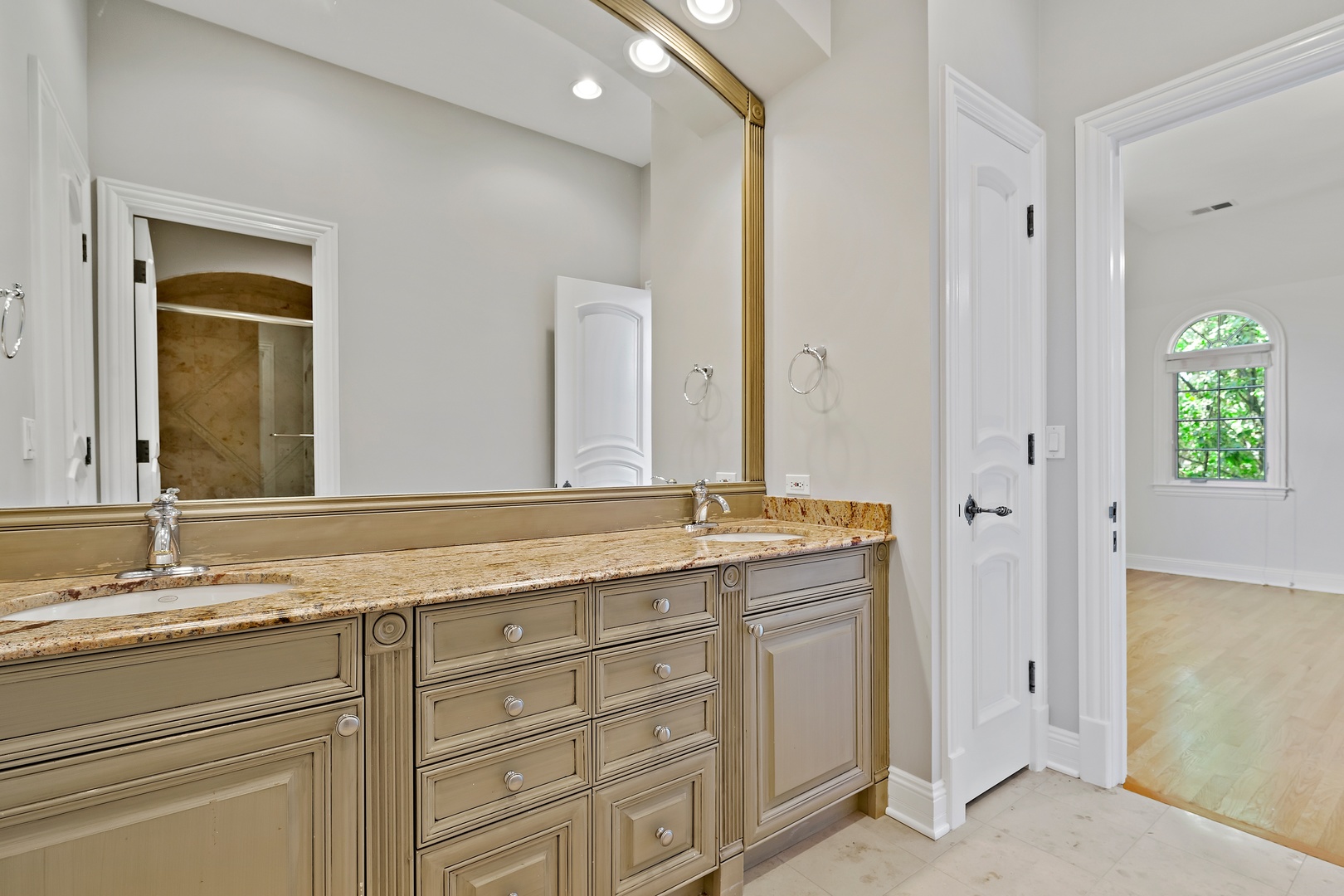 3151 Keystone Road Northbrook, IL 60062 - Photo 27 of 48 a bathroom with a granite countertop sink and a mirror