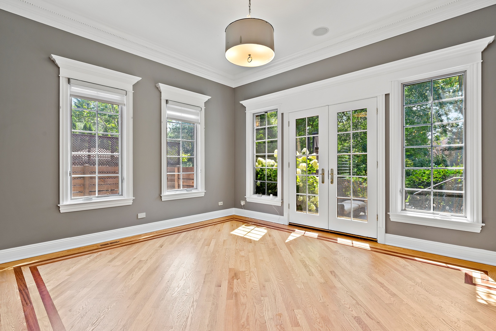 3151 Keystone Road Northbrook, IL 60062 - Photo 4 of 48 a view of an empty room with wooden floor and a window