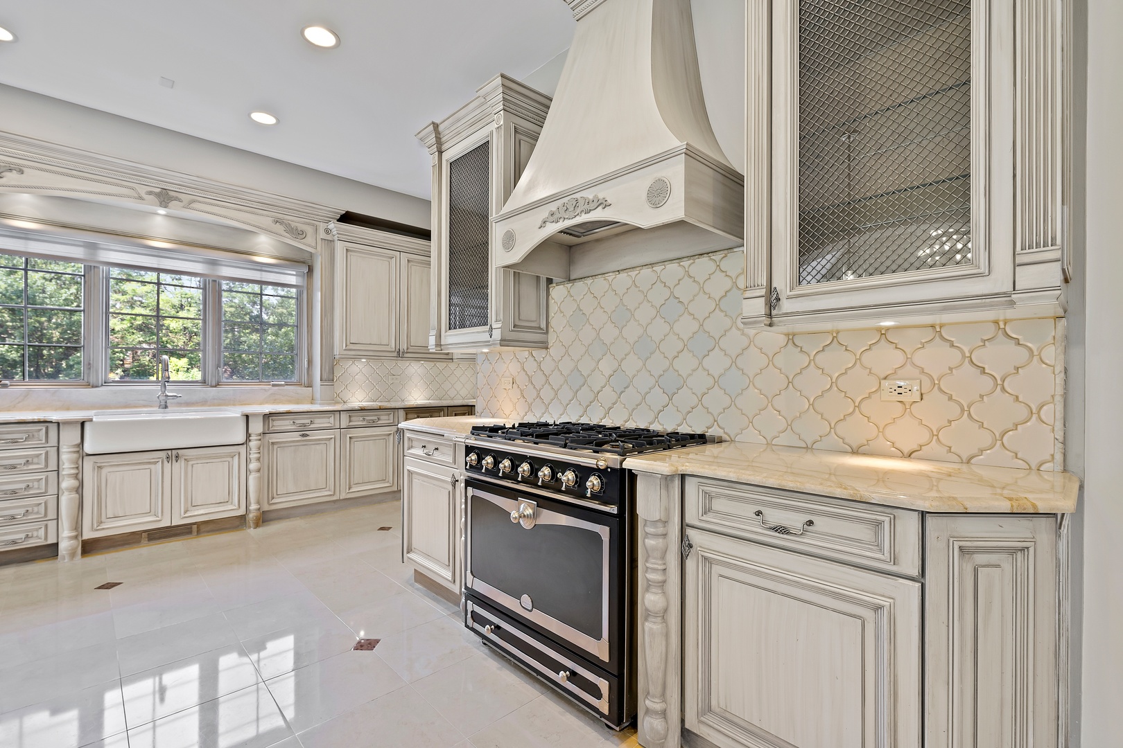 3151 Keystone Road Northbrook, IL 60062 - Photo 6 of 48 a kitchen with white cabinets and a stove top oven